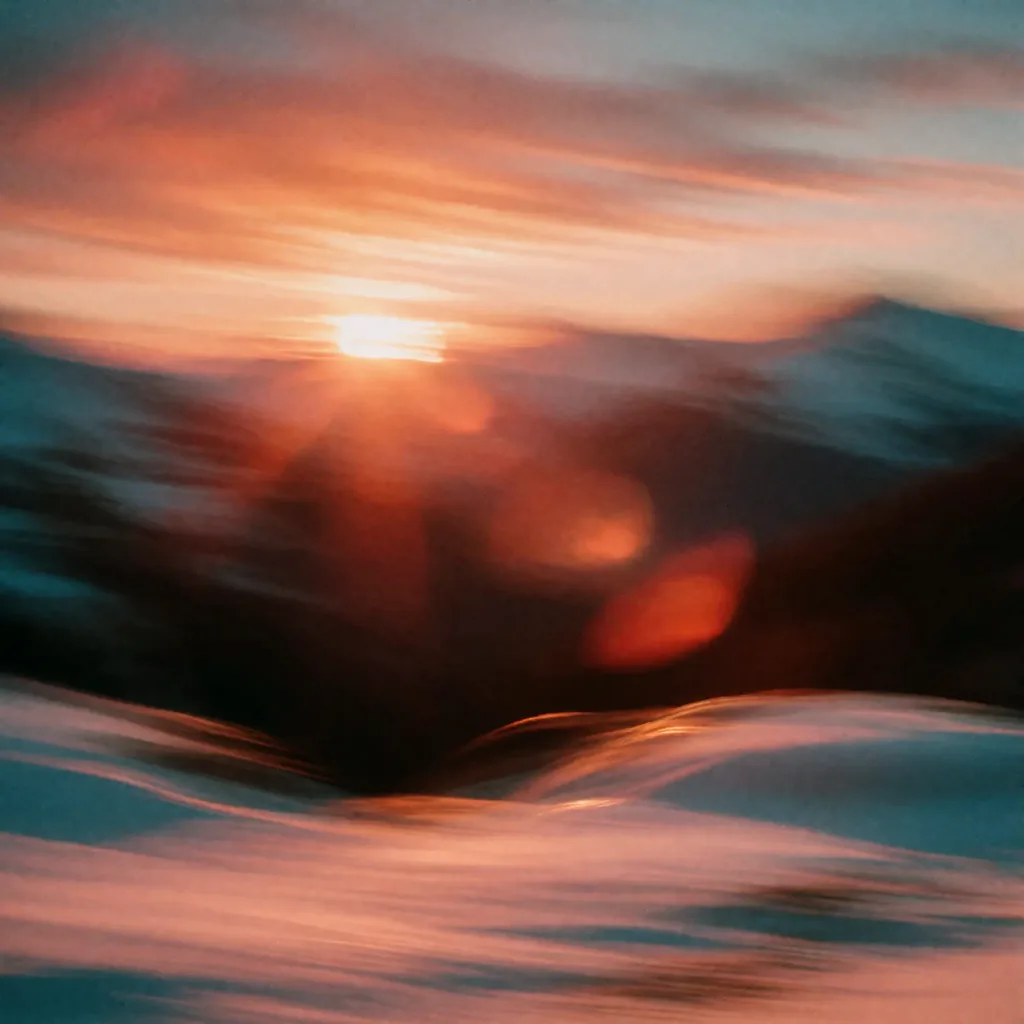 A sunset over snowy mountains, made with the Krea 2 Sunset Blur LoRA
